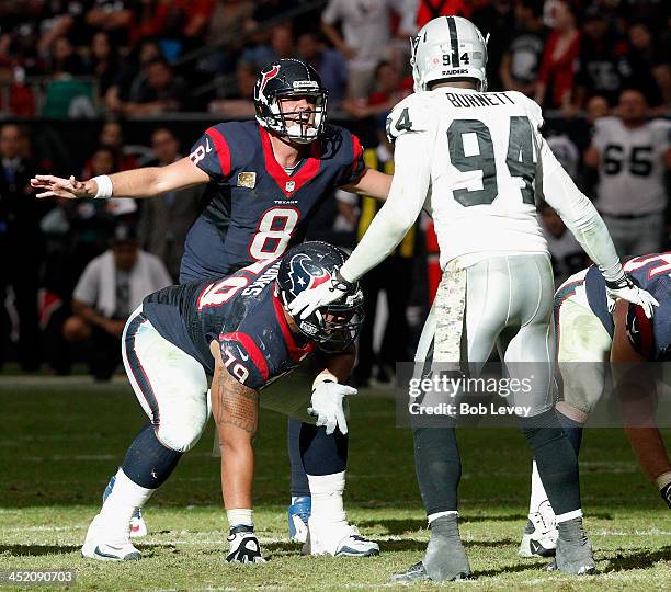 Matt Schaub of the Houston Texans calls out the play from the line of scrimmage as he awaits the snap from center Chris Myers and Kevin Burnett of...