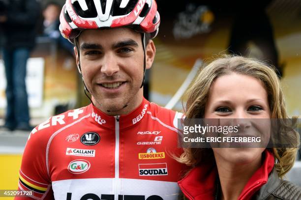 France's Tony Gallopin poses with his girlfriend French cyclist Marion Rousse as he leaves the signature ceremony before the start of the 170 km...