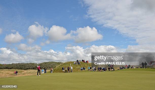 Player Mo Martin putts on the 9th green on the fourth day of the Women's British Open at Royal Birkdale golf course in Southport, northwest England...