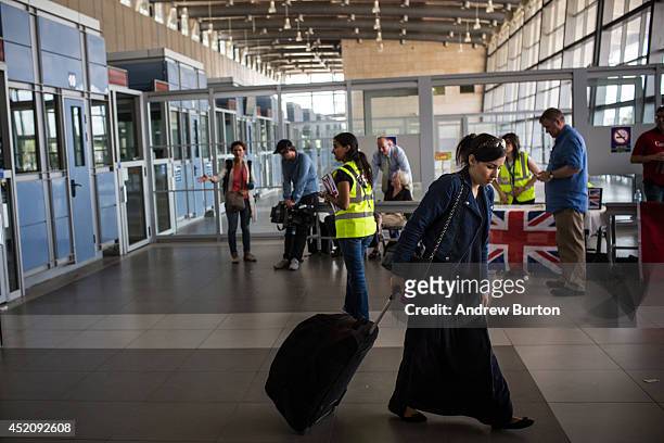Woman crosses back into Israel from Gaza during evacuations on the sixth day of Israel's operation 'Protective Edge' on July 13, 2014 in Erez,...