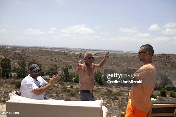 Israelis sing and dance on a hill overlooking the Gaza Strip on July 13, 2014 near Sderot, Israel . Israel's Operation Protective Edge entered its...