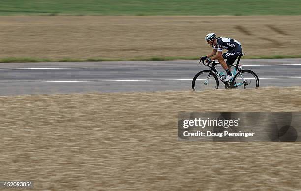 Niki Terpstra of The Netherlands and the Omega Pharma - Quick-Step Cycling Team is the first rider off the front as he introduces the breakaway...