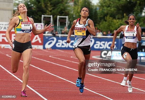 French athlete Marie Gayot competes and wins the women's 400m event ahead of French athletes Floria Guei and Madiea Ghafoor on July 13, 2014 during...