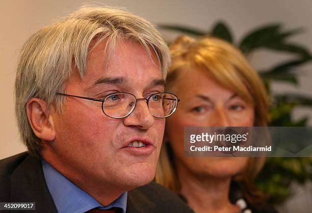 Former Chief Whip Andrew Mitchell is watched by his wife Dr Sharon Bennett as he speaks to reporters on November 26, 2013 in London, England. One...