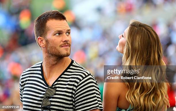 Athlete Tom Brady and model Gisele Bundchen look on prior to the 2014 FIFA World Cup Brazil Final match between Germany and Argentina at Maracana on...