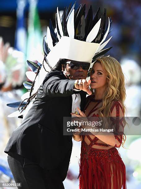Musicians Carlinhos Brown and Shakira perform during the closing ceremony prior to the 2014 FIFA World Cup Brazil Final match between Germany and...