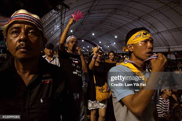 Anti-government protesters take part in a rally at Democracy Monument on November 26, 2013 in Bangkok, Thailand. The Prime Minister of Thailand,...