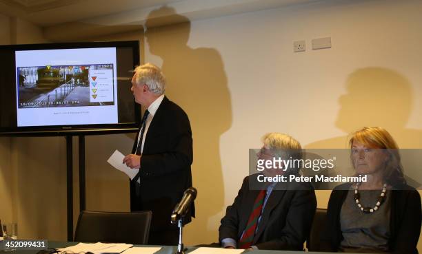 Former Chief Whip Andrew Mitchell sits with his wife Dr Sharon Bennett as David Davies shows video evidence to reporters on November 26, 2013 in...