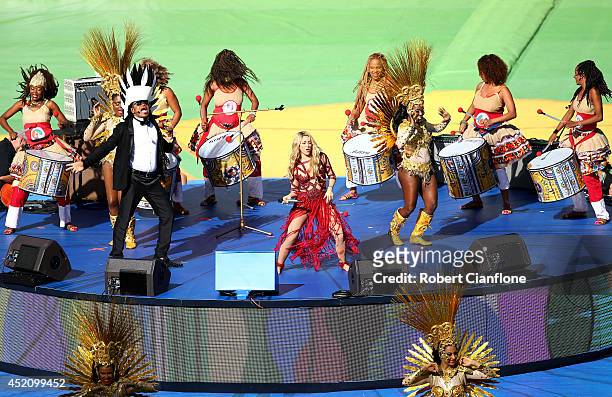 Singer Shakira and musician Carlinhos Brown perform during the closing ceremony prior to the 2014 FIFA World Cup Brazil Final match between Germany...