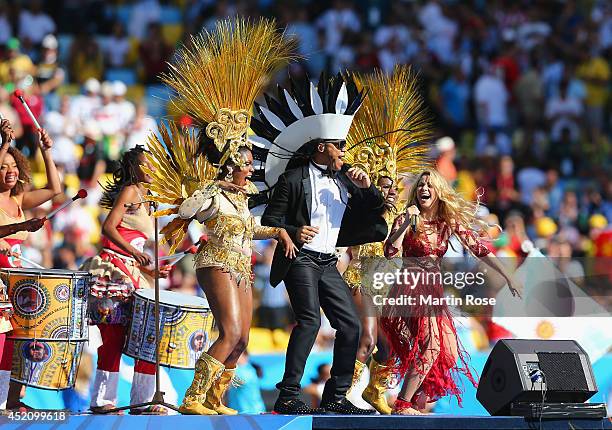 Musician Carlinhos Brown and singer Shakira perform during the closing ceremony prior to the 2014 FIFA World Cup Brazil Final match between Germany...