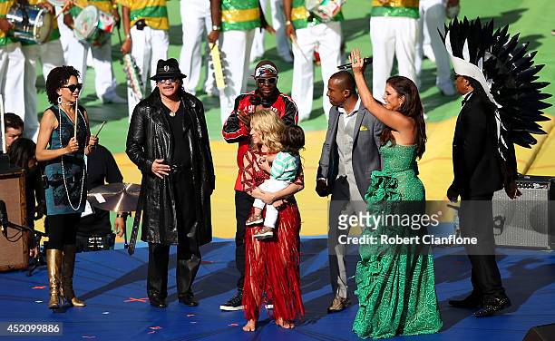 Musicians Carlos Santana, Wyclef Jean, singers Shakira, Alexandre Pires, Ivete Sangalo and Carlinhos Brown perform during the closing ceremony prior...