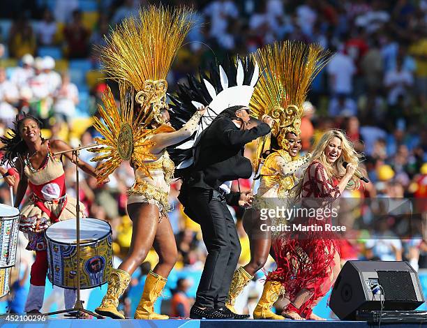 Musician Carlinhos Brown and singer Shakira perform during the closing ceremony prior to the 2014 FIFA World Cup Brazil Final match between Germany...