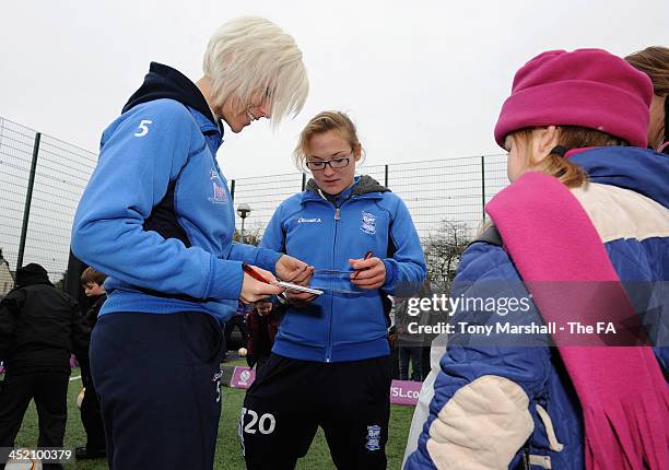Cristina Torkilsen and Katie Wilkinson of Birmingham City Ladies FC signing autographs during the FA Girls Fanzone before the UEFA Womens U17...