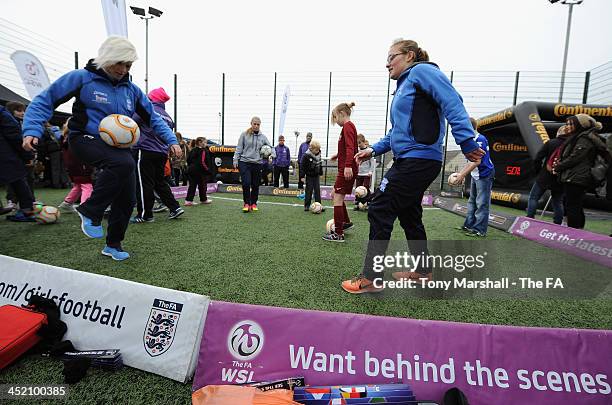 Cristina Torkilsen and Katie Wilkinson of Birmingham City Ladies FC show off their ball skills during the FA Girls Fanzone before the UEFA Womens U17...