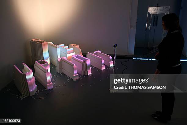 Person looks at an artwork made of sugar by Austrian-born artist Stefan Sagmeister during the press presentation of the exhibition ''The Happy...