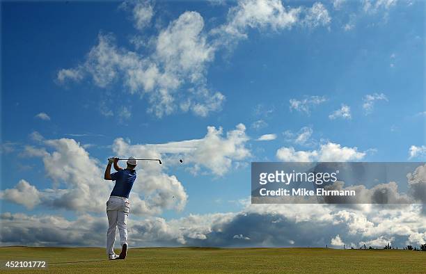 Justin Rose of England hits hit approach shot on the 16th hole during the final round of the 2014 Aberdeen Asset Management Scottish Open at Royal...