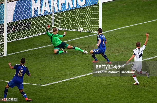 Gonzalo Higuain of Argentina scores a goal past Manuel Neuer of Germany but it is disallowed due to offsides being called during the 2014 FIFA World...