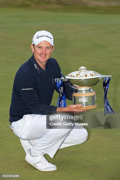 Justin Rose celebrates winning the final round of the Aberdeen Asset Management Scottish Open, at Royal Aberdeen on July 13, 2014 in Aberdeen,...