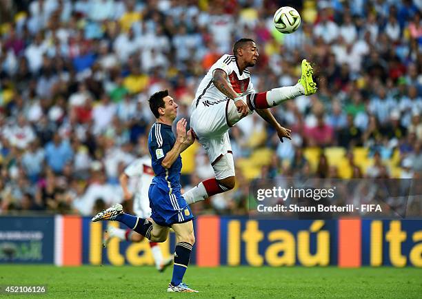 Jerome Boateng of Germany and Lionel Messi of Argentina compete for the ball during the 2014 FIFA World Cup Brazil Final match between Germany and...
