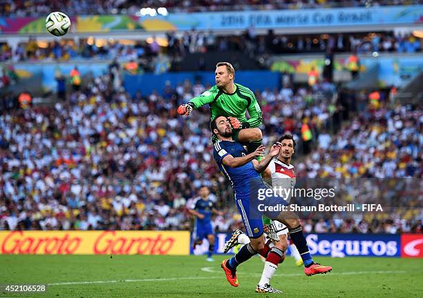 Gonzalo Higuain of Argentina and Manuel Neuer of Germany collide during the 2014 FIFA World Cup Brazil Final match between Germany and Argentina at...