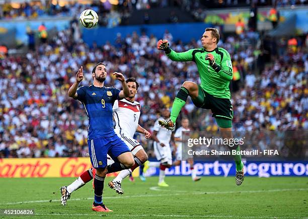 Gonzalo Higuain of Argentina and Manuel Neuer of Germany collide during the 2014 FIFA World Cup Brazil Final match between Germany and Argentina at...