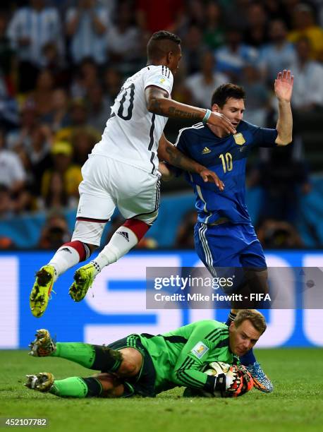 Lionel Messi of Argentina, Manuel Neuer and Jerome Boateng of Germany compete for the ball during the 2014 FIFA World Cup Brazil Final match between...