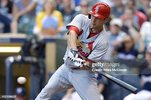 George Kottaras of the St. Louis Cardinals hits a RBI single in the top of the ninth inning against the Milwaukee Brewers at Miller Park on July 13,...