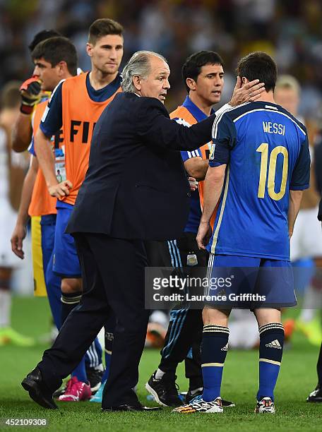 Head coach Alejandro Sabella of Argentina speaks to Lionel Messi during the 2014 FIFA World Cup Brazil Final match between Germany and Argentina at...