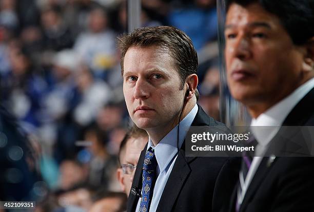 Assistant coach Joe Sacco and interim head coach Ted Nolan of the Buffalo Sabres watch the action against the Toronto Maple Leafs on November 15,...