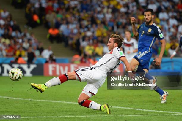 Mario Goetze of Germany scores his team's first goal in extra time during the 2014 FIFA World Cup Brazil Final match between Germany and Argentina at...