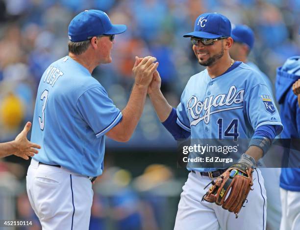Manager Ned Yost of the Kansas City Royals and Omar Infante celebrate a 5-2 win over the Detroit Tigers on July 13, 2014 at Kauffman Stadium in...