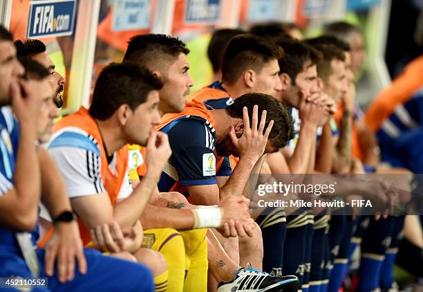 Gonzalo Higuain of Argentina is seen on the bench after Germany's first goal during the 2014 FIFA World Cup Brazil Final match between Germany and...