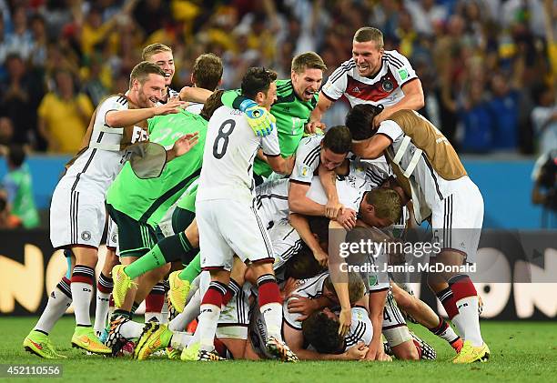 Germany celebrate defeating Argentina 1-0 in extra time during the 2014 FIFA World Cup Brazil Final match between Germany and Argentina at Maracana...