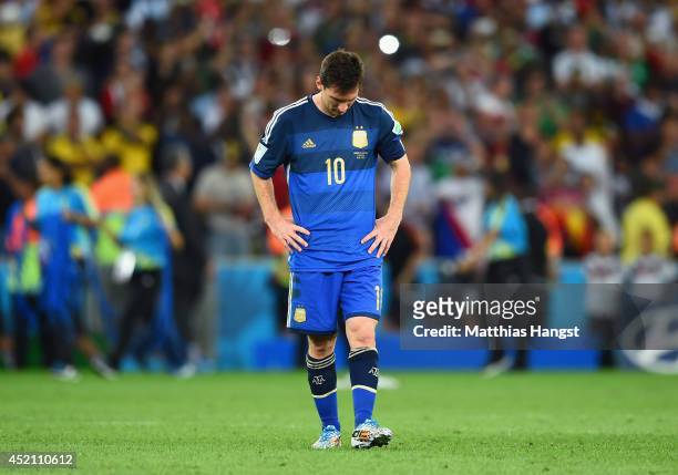 Dejected Lionel Messi of Argentina reacts after being defeated by Germany 1-0 in extra time during the 2014 FIFA World Cup Brazil Final match between...