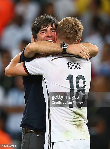 Head coach Joachim Loew and Toni Kroos of Germany celebrate defeating Argentina 1-0 in the 2014 FIFA World Cup Brazil Final match between Germany and...