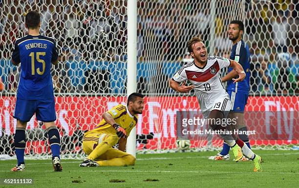 Mario Goetze of Germany celebrates scoring his team's first goal in extra time during the 2014 FIFA World Cup Brazil Final match between Germany and...