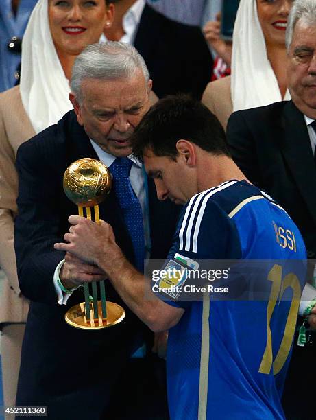 Jose Maria Marin, President of the CBF, presents Lionel Messi of Argentina with the Golden Ball during the 2014 FIFA World Cup Brazil Final match...