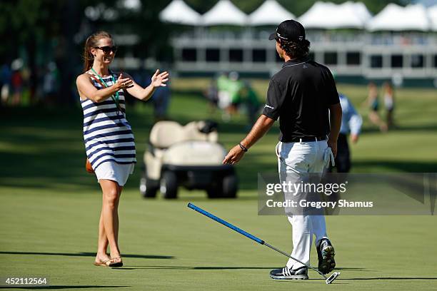 Brian Harman embraces his fiance Kelly Van Slyke after winning the John Deere Classic held at TPC Deere Run on July 13, 2014 in Silvis, Illinois.