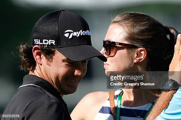 Brian Harman celebrates with his fiance Kelly Van Slyke after winning the John Deere Classic held at TPC Deere Run on July 13, 2014 in Silvis,...