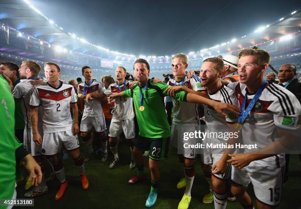 Kevin Grosskreutz, Julian Draxler, Benedikt Hoewedes, Roman Weidenfeller, Matthias Ginter, Shkodran Mustafi and Erik Durm of Germany celebrate after...