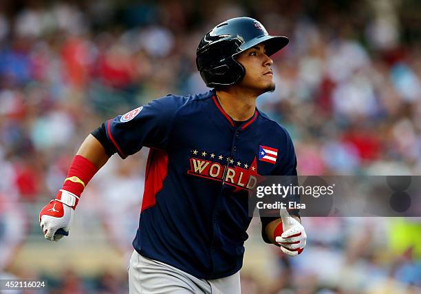 Javier Baez of the World Team rounds the bases after hitting a two-run home run against the U.S. Team during the SiriusXM All-Star Futures Game at...