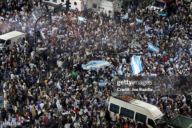 Argentine soccer fans fill an area near the Obelisco de Buenos Aires after the World Cup final on July 13, 2014 in Buenos Aires, Argentina. Germany...