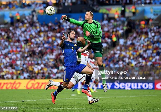 Gonzalo Higuain of Argentina and Manuel Neuer of Germany collide during the 2014 FIFA World Cup Brazil Final match between Germany and Argentina at...