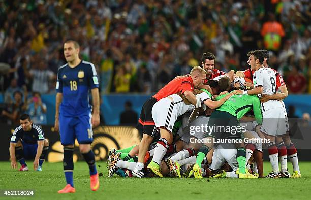 Germany celebrate after defeating Argentina 1-0 in extra time during the 2014 FIFA World Cup Brazil Final match between Germany and Argentina at...
