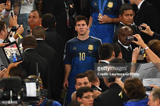 Dejected Lionel Messi of Argentina looks on after being defeated by Germany 1-0 in extra time during the 2014 FIFA World Cup Brazil Final match...