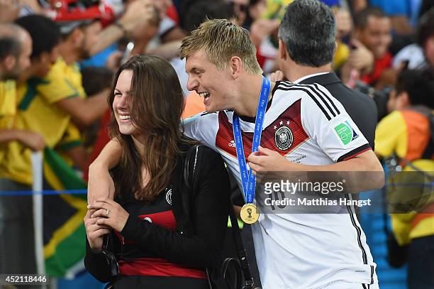 Toni Kroos of Germany celebrates with girlfriend Jessica Farber after defeating Argentina 1-0 in extra time during the 2014 FIFA World Cup Brazil...