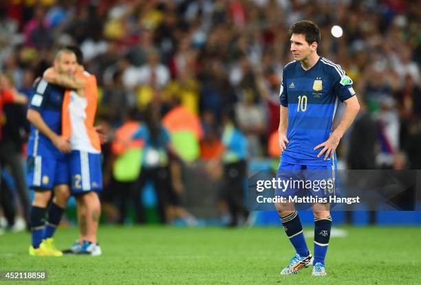 Dejected Lionel Messi of Argentina looks on after being defeated by Germany 1-0 in extra time during the 2014 FIFA World Cup Brazil Final match...