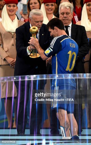 Jose Maria Marin, President of the CBF, presents Lionel Messi of Argentina with the Golden Ball during the award ceremony of the 2014 FIFA World Cup...