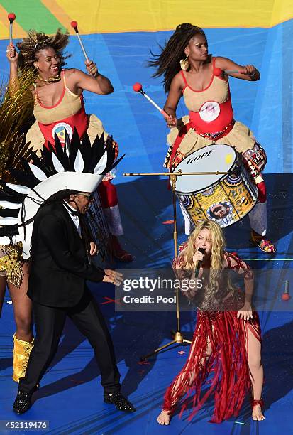 Musicians Carlinhos Brown and Shakira perform during the closing ceremony prior to the 2014 FIFA World Cup Brazil Final match between Germany and...