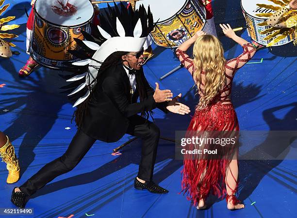 Musicians Carlinhos Brown and Shakira perform during the closing ceremony prior to the 2014 FIFA World Cup Brazil Final match between Germany and...